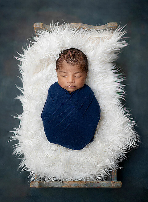 Swaddled newborn photograph